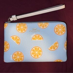 Coach orange wristlet
